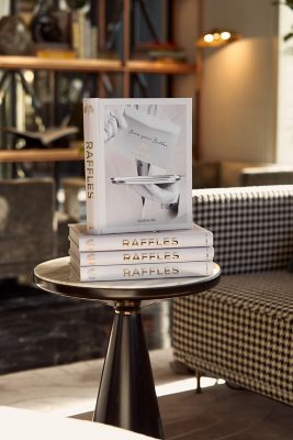 Stack of "Raffles" Books on a Table in a Hotel Lobby