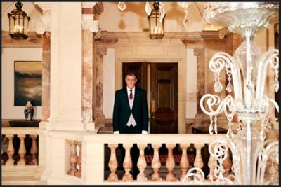 Man in a grand hallway