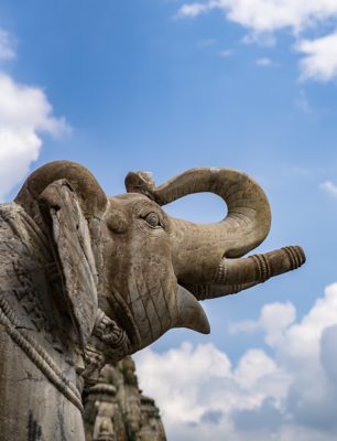 Stone Elephant Sculpture Under a Blue Sky