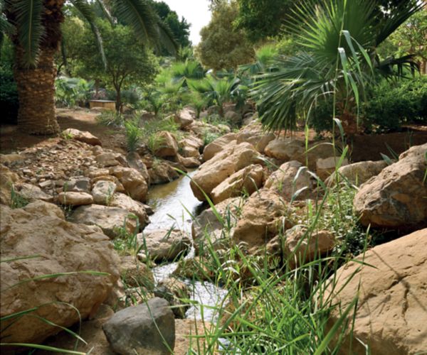 Natural stream flowing through the eco-friendly gardens at Mövenpick Hotel Amman in Jordan