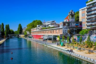 Street art on buildings lining the Canal Saint-Martin in Paris