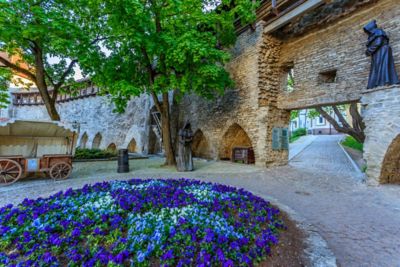 The quiet, flower-filled courtyard of the Danish King’s Garden in Tallinn Old Town