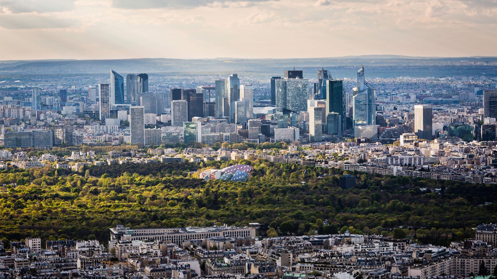 Parisian Panorama: La Défense, Bois de Boulogne, and the City at Sunset