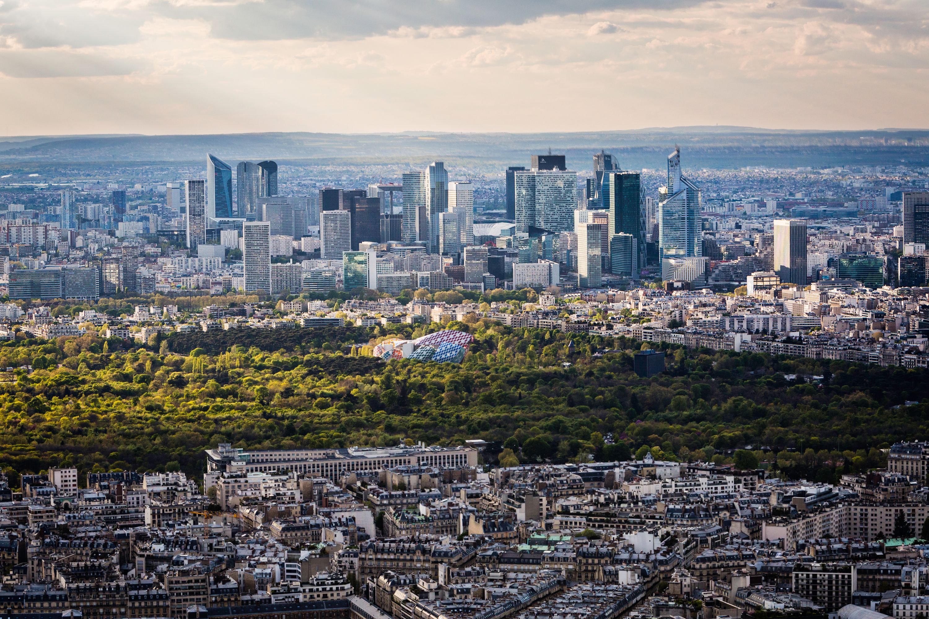 Parisian Panorama: La Défense, Bois de Boulogne, and the City at Sunset
