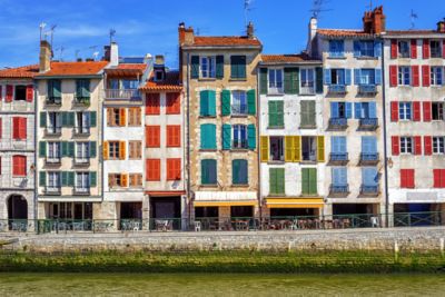Tall houses with multicoloured window shutters in the French Basque Country
