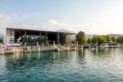 People enjoying the lakeside terrace at Lucerne's beautiful KKL concert hall