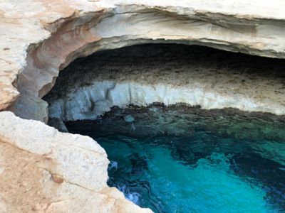 St Peter’s Pool, a natural swimming hole with crystal-clear waters, in Malta