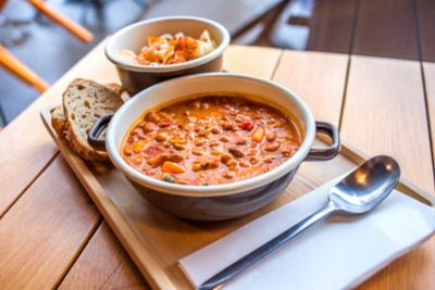 A bowl of meat and bean stew at a kafana tavern in Serbia