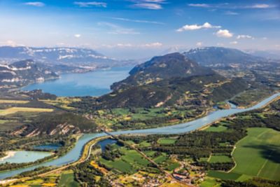 Placid Lake Bourget, framed by rugged mountains, in France's Savoie region