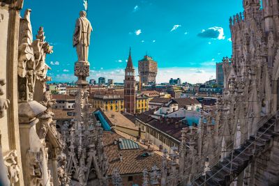Milan's skyline, with the cathedral's Gothic spires and a mix of historic and modern buildings