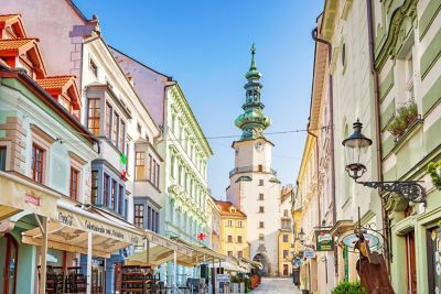 An alley in Bratislava Old Town, lined with pastel-coloured buildings
