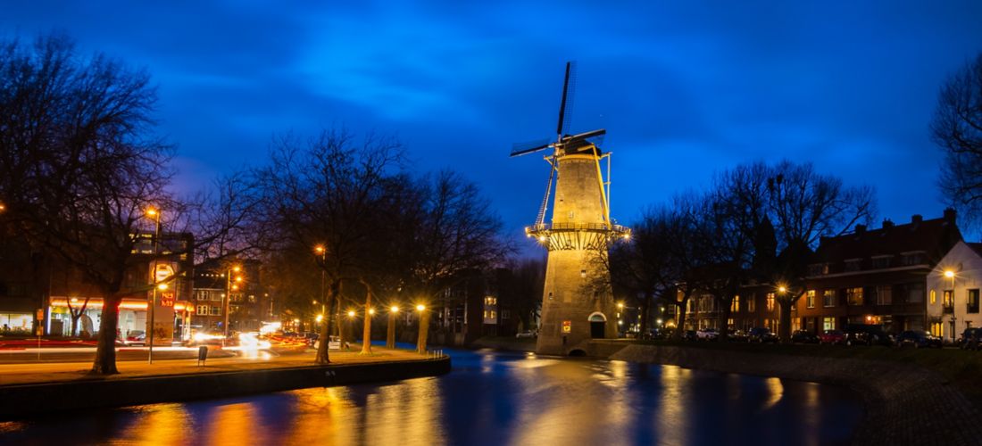 Illuminated Windmill in Schiedam, South Holland at Twilight