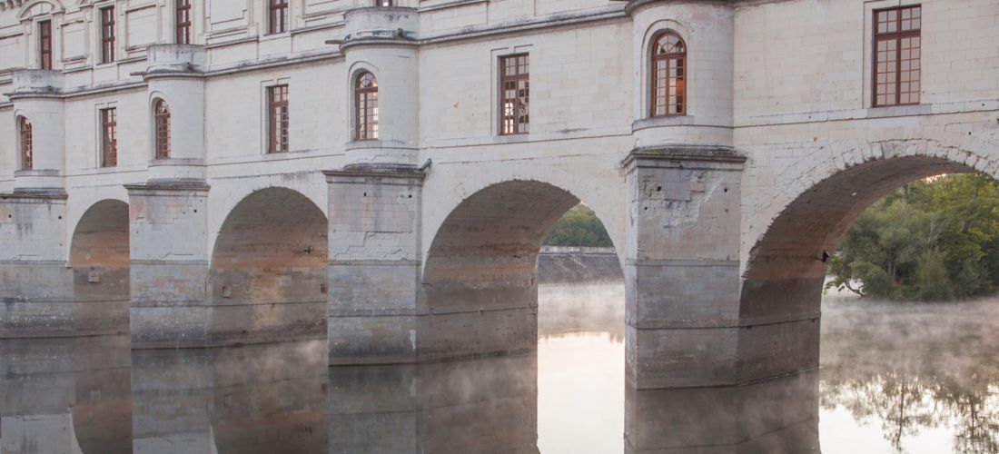 Misty Dawn at Chenonceau: Arches Reflected on the Cher River
