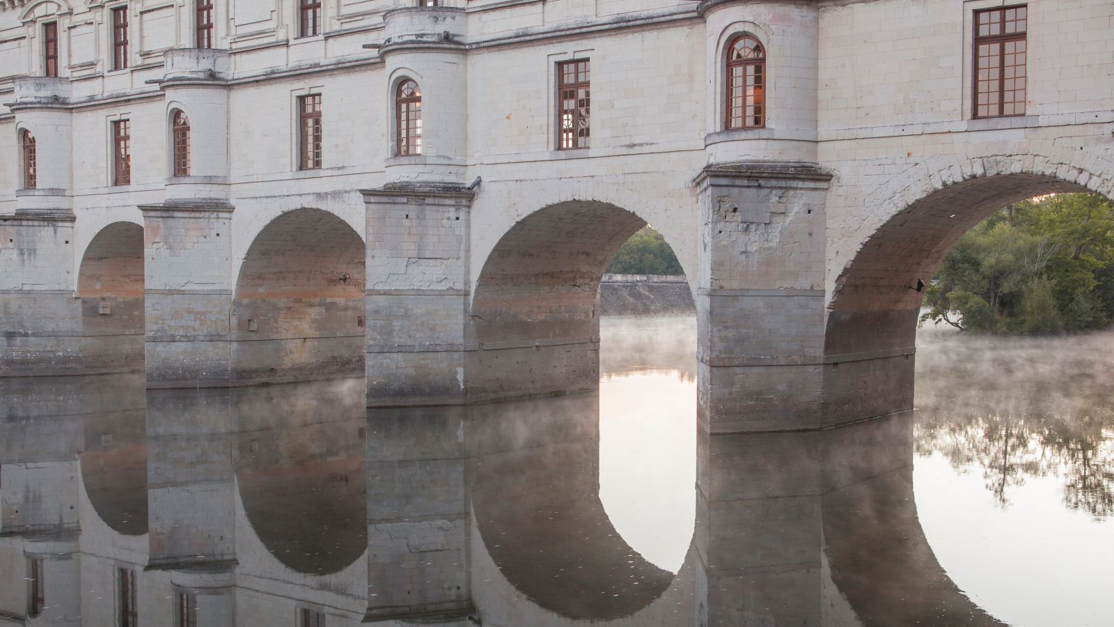 Misty Dawn at Chenonceau: Arches Reflected on the Cher River