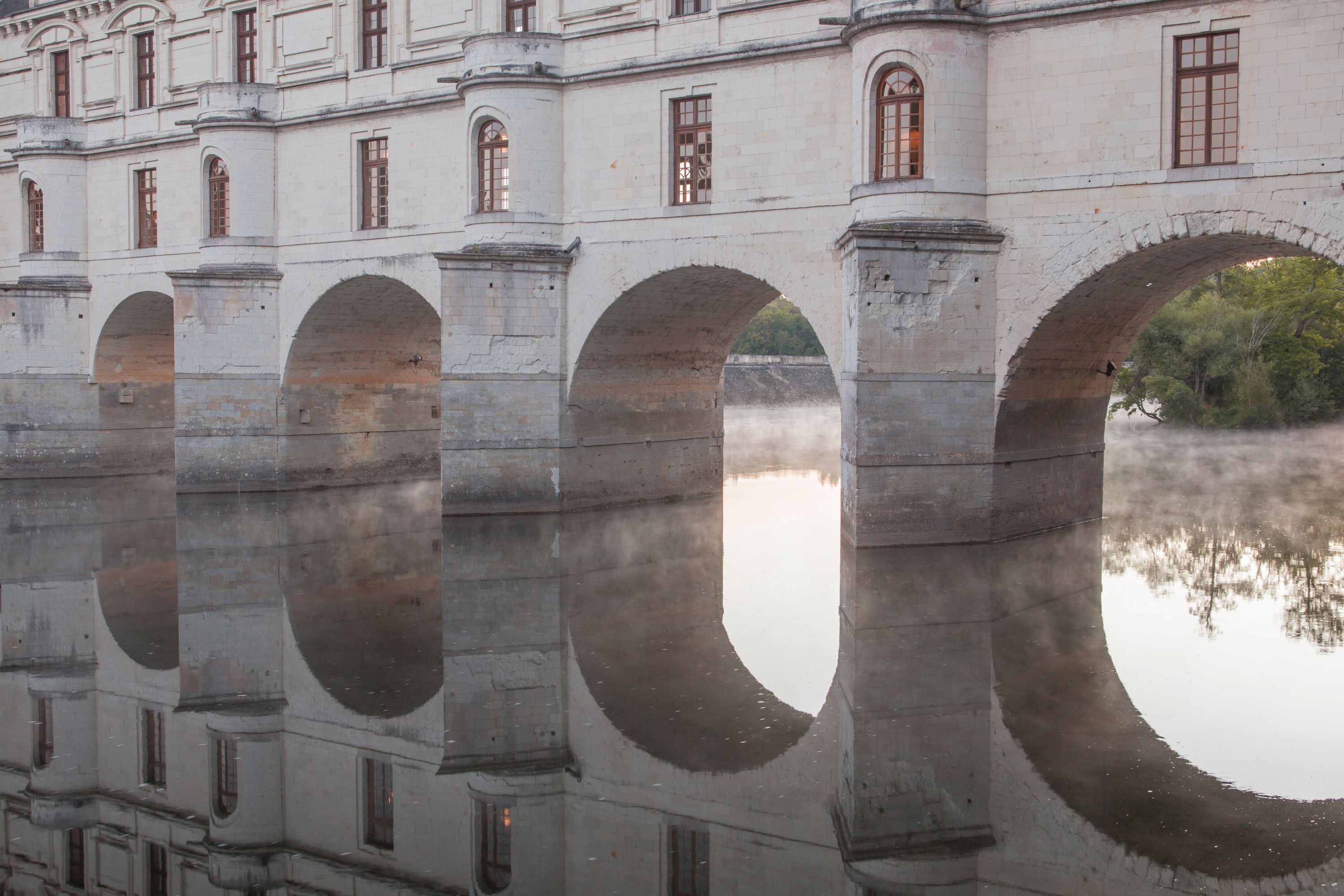 Misty Dawn at Chenonceau: Arches Reflected on the Cher River