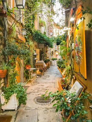 Artisan shops and art galleries in an alleyway in a village near Nice, France