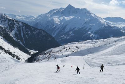 Skiers on a slope in La Rosière, a family-friendly ski resort in France