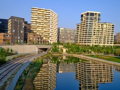 Modern urban architecture lining a waterfront in the Batignolles district, Paris