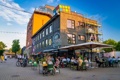 The brick façade of the Fotografiska Tallinn museum, with a rooftop bar