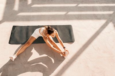 A traveller stretching as part of a morning exercise routine