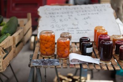 Fruit preserves, a common souvenir to buy in France, at a market stand