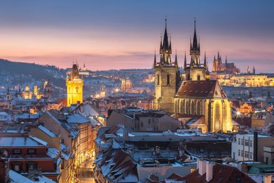 Prague Castle's elegant twin spires overlooking the city on a winter's evening