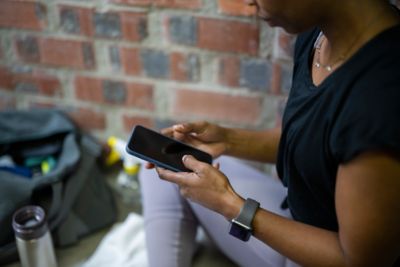 A person checking their phone while at the gym