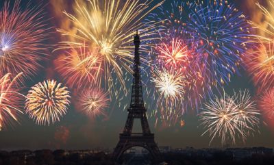 Colourful fireworks illuminating the night sky over the Eiffel Tower in Paris