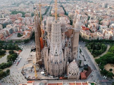 Cranes and protective sheeting amid the spires of Gaudí's unfinished Sagrada Família in Barcelona