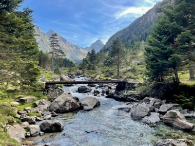 A boulder-strewn stream amid rugged mountains in the isolated French Pyrenees
