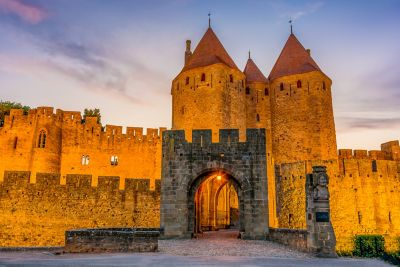 Carcassonne's stone façade glowing a brilliant orange at sunset