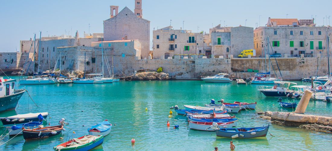 Medieval Giovinazzo Harbor: Boats and Azure Waters