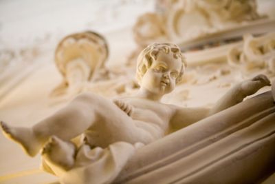 A Baroque sculpture of a cherub in a palace