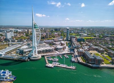 The sail-shaped Spinnaker Tower overlooking Portsmouth's coastline and harbour
