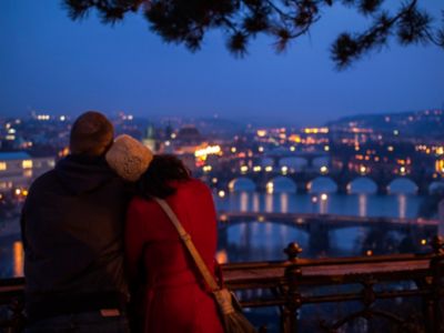 A couple enjoying beautiful Vltava River views from Letná Park in Prague