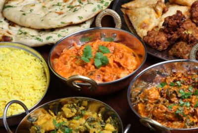 Indian curries, rice, naan bread and appetisers presented in a fine dining style