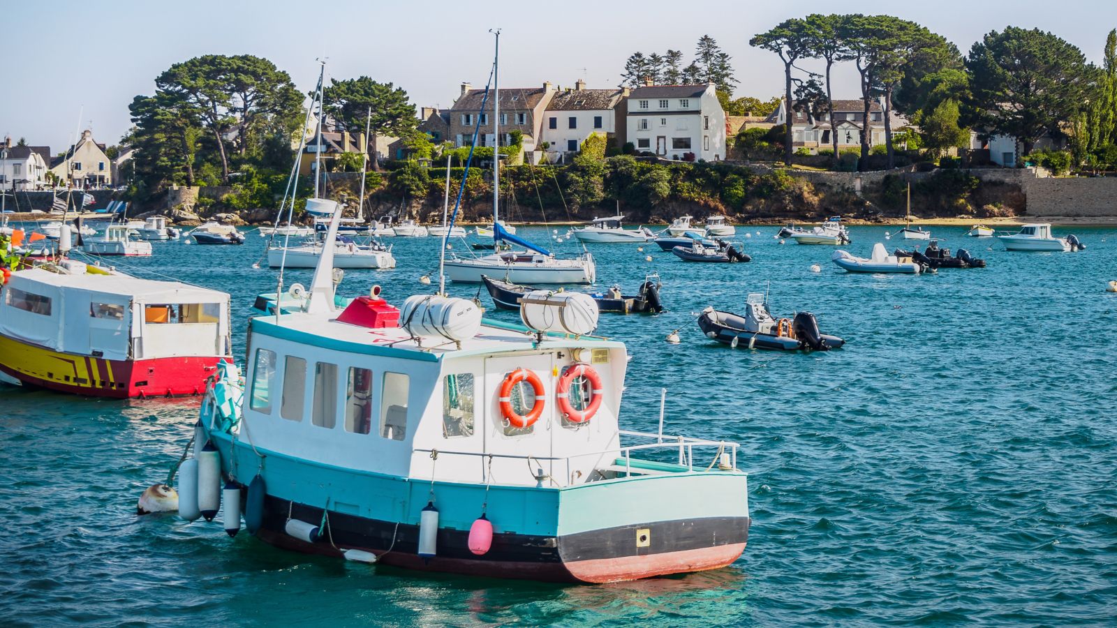 Sunny harbor scene with boats in the Golfe du Morbihan, Brittany