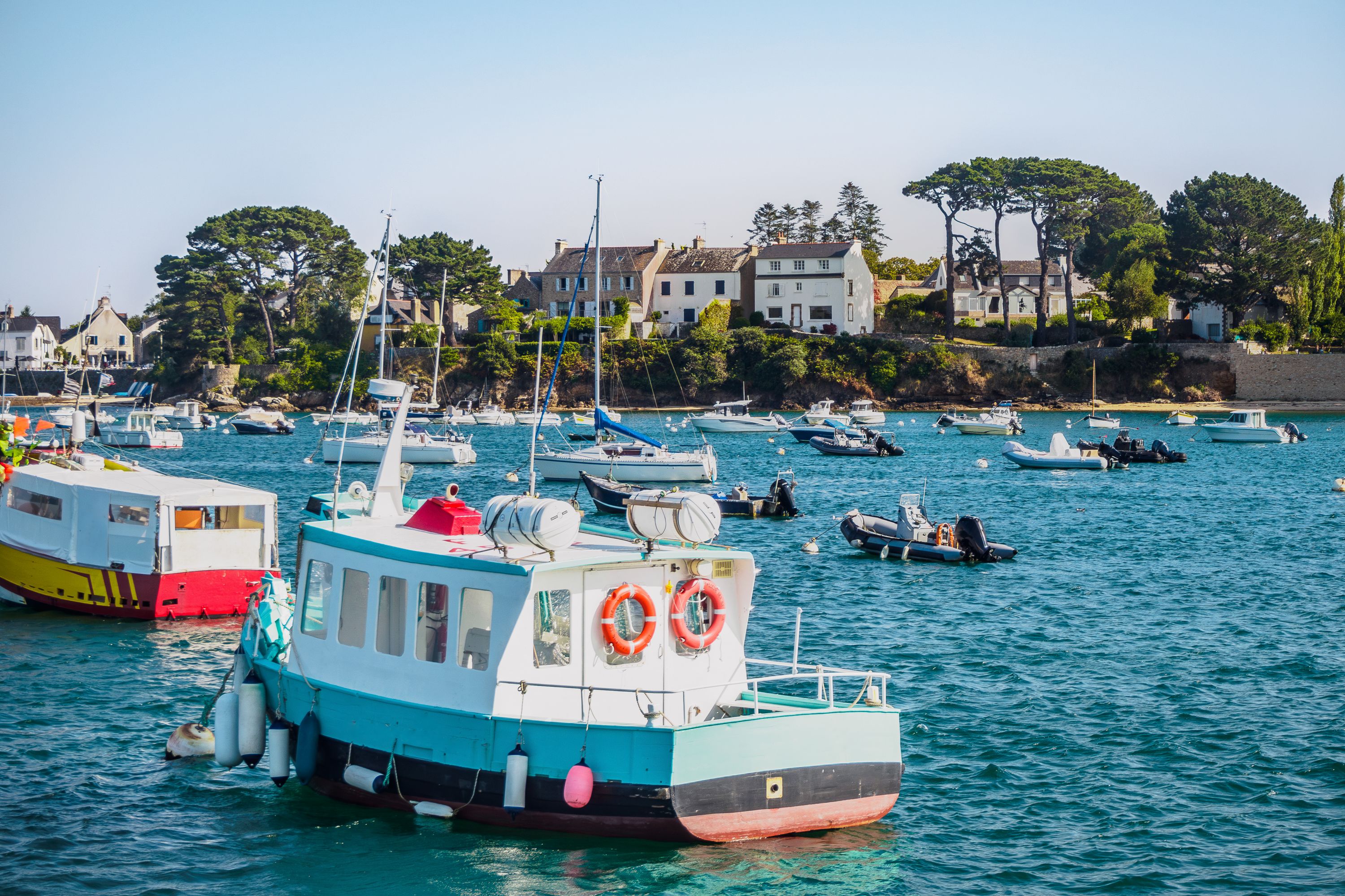 Sunny harbor scene with boats in the Golfe du Morbihan, Brittany