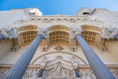The intricately detailed entrance of the Basilica of Notre-Dame de Fourvière in Lyon
