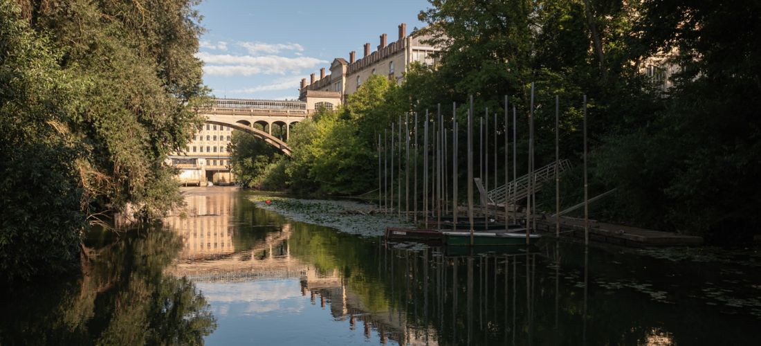 Tranquil River Scene with Old Bridge
