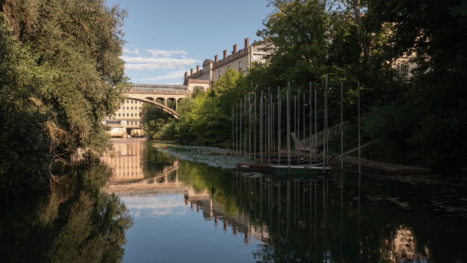 Tranquil River Scene with Old Bridge