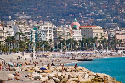 A beach backed by buildings on the Promenade des Anglais in Nice, France