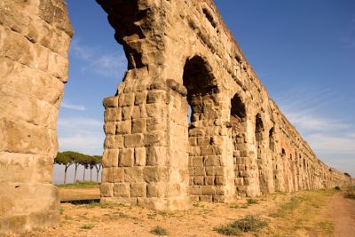 Weathered stone arches along the Appian Way in Rome