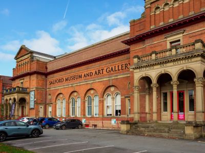 The sweeping red-brick façade of the Salford Museum and Art Gallery in Manchester