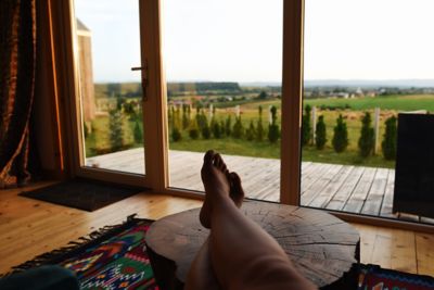 A person disconnecting while sitting back and gazing at a country landscape