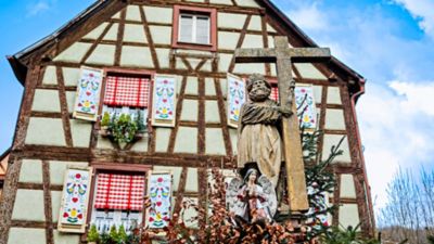 A half-timbered house in Kaysersberg, Alsace, decorated colourfully for Christmas