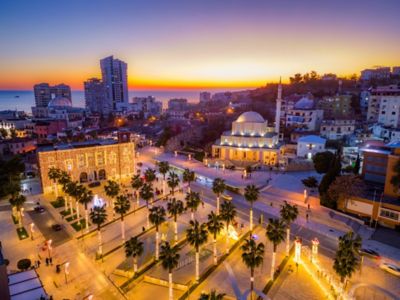 The centre of Durrës, Albania, with its Great Mosque and Town Hall, illuminated