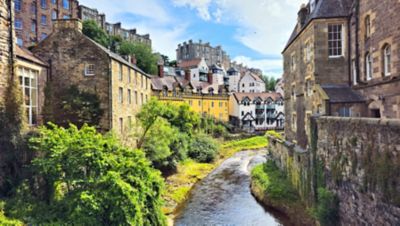 Medieval architecture lining a narrow waterway in Edinburgh, Scotland