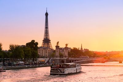 A Seine river cruise passing the Eiffel Tower in the early evening