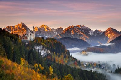 Neuschwanstein Castle surrounded by Alpine hinterland in an autumn glow
